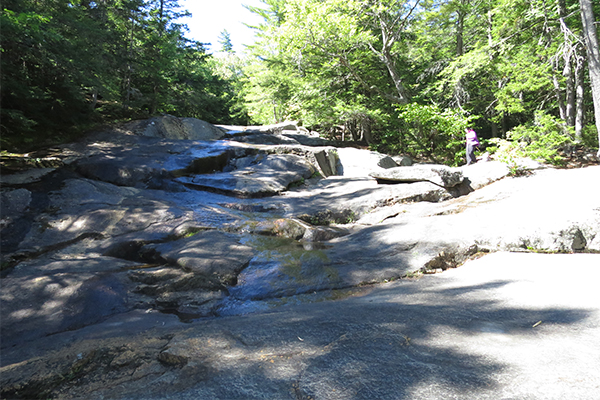 the sunny slabs of the lower falls of Beede Falls, New Hampshire